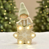 Figurine de Noël Garçon à bonnet vert sur Flocon LED